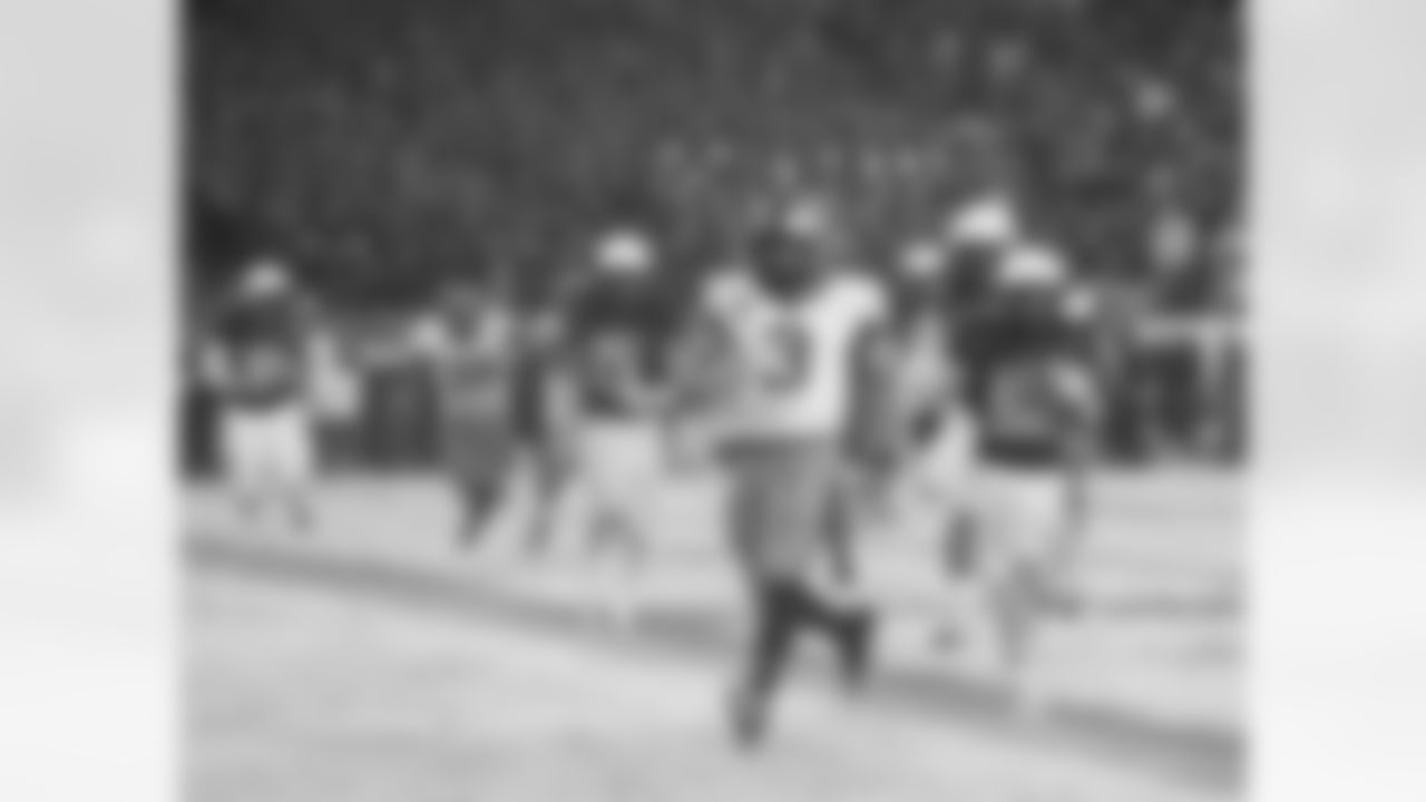 Army quarterback Angel Santiago runs in touchdown during the second half