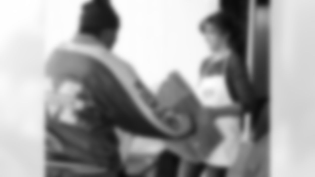 Lindsay Mornhinweg helps load a truck with cases of food