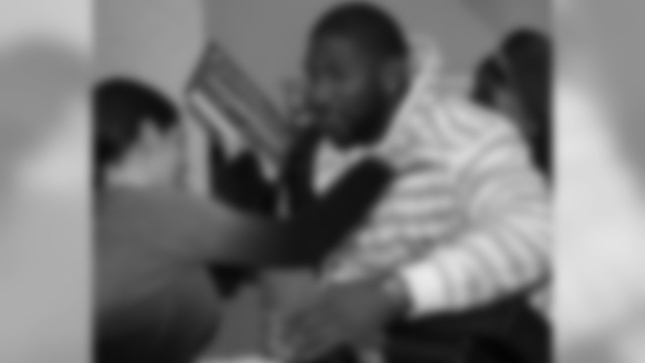 Akeem Jordan gives a fan a hug