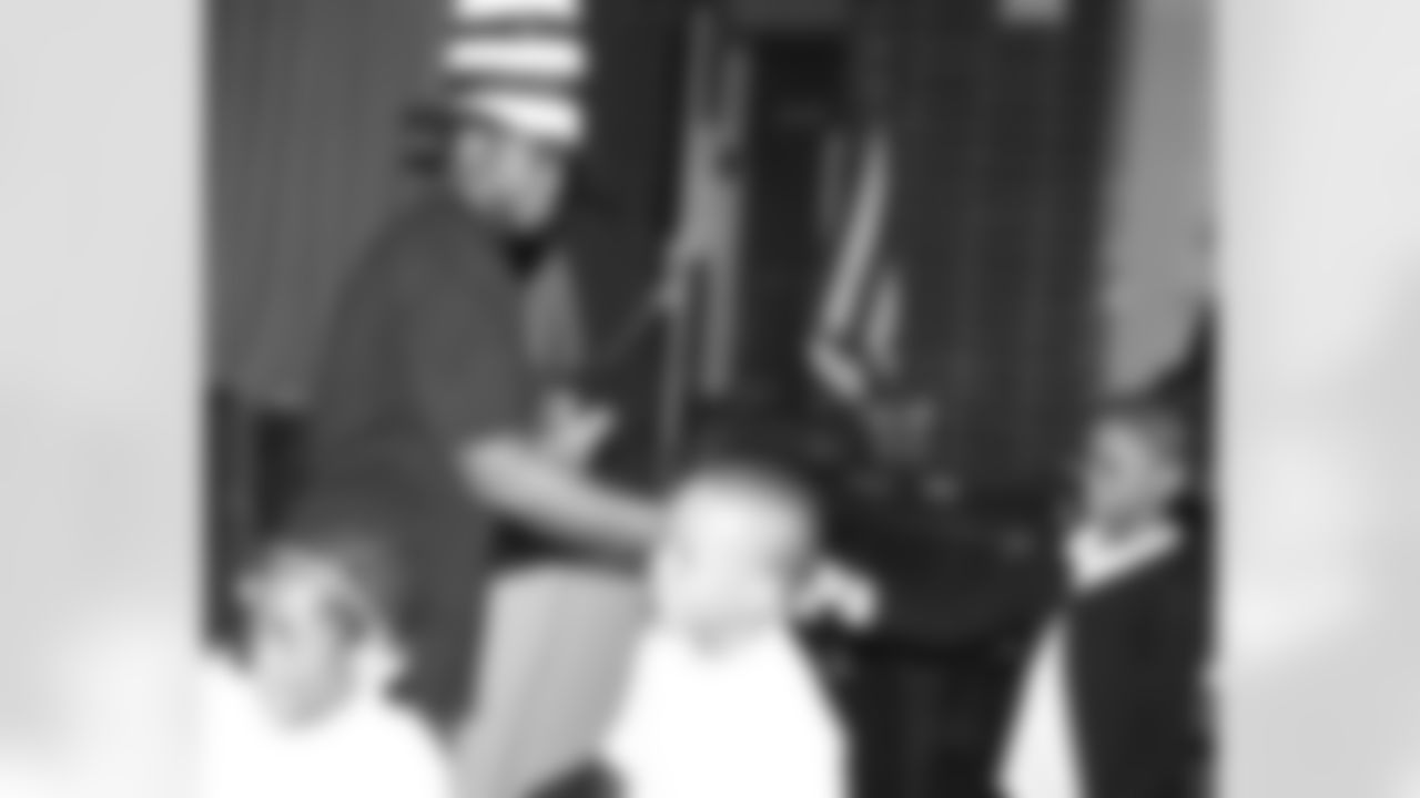 Omar gives bookmarks to students