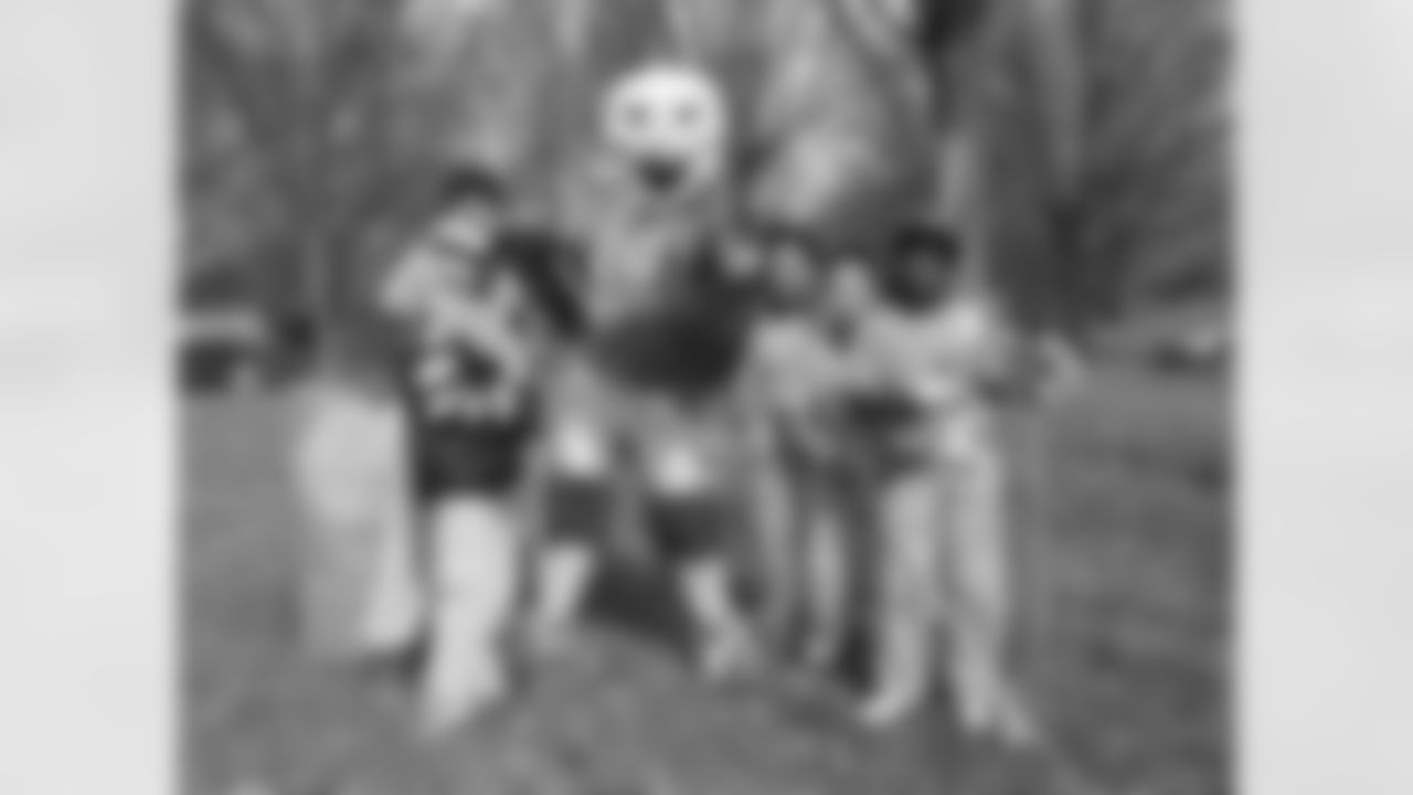 Swoop poses for a photo in between tree planting