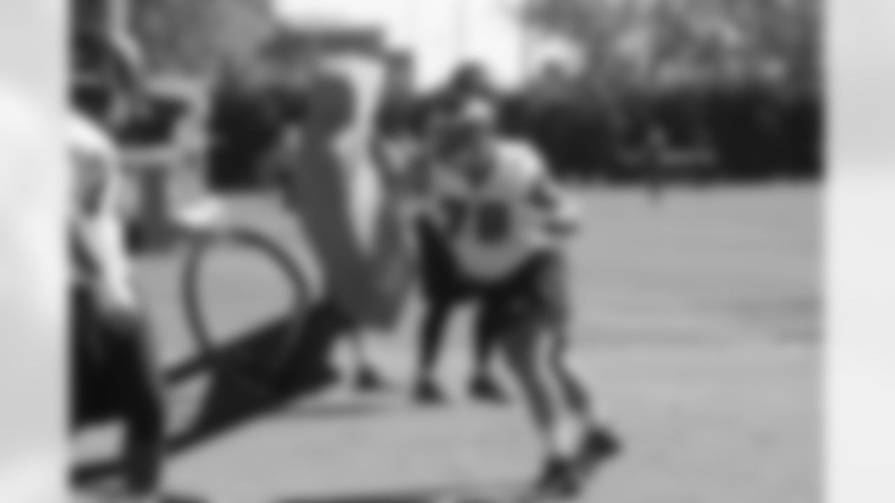 DE Travis Raciti takes his turn on the sled