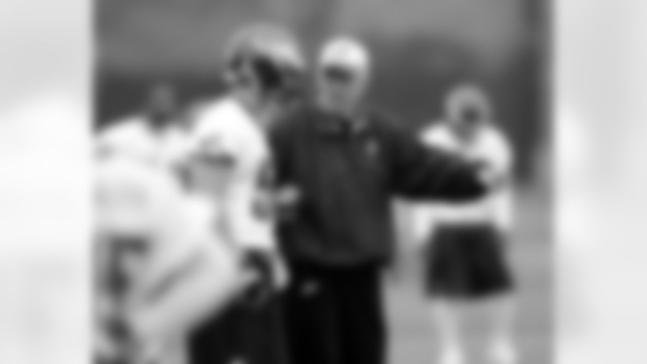 Defensive coordinator Jim Johnson offers some instruction