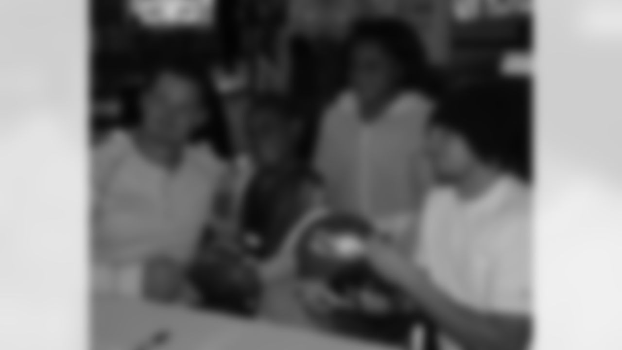 Curtis and Kolb take a moment to pose with these two fans