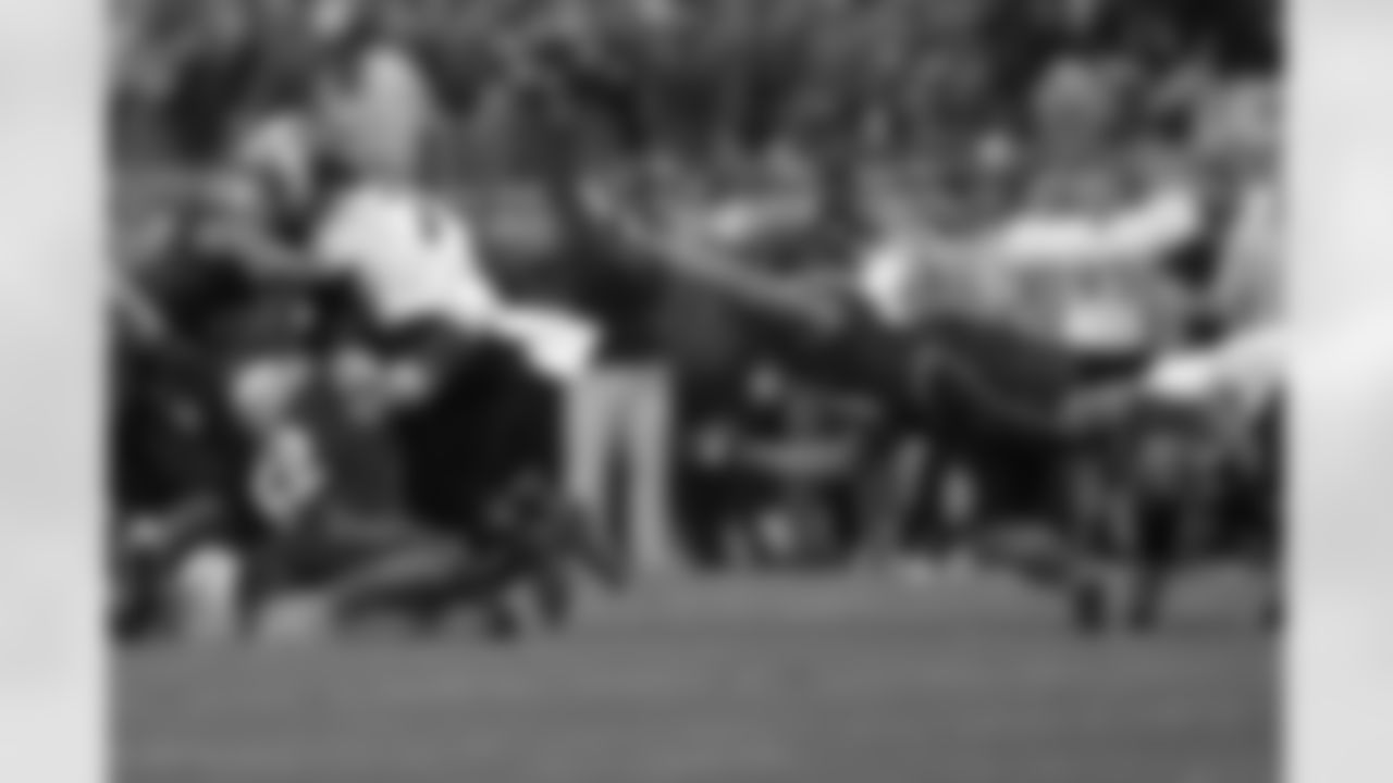 Navy players go in for the tackle