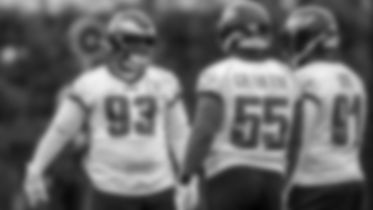DT Javon Hargrave talking to DE Brandon Graham and DT Fletcher Cox