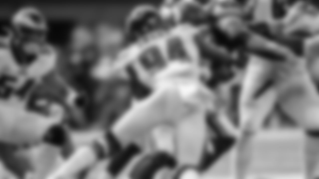 DE Josh Sweat tackles a Vikings ballcarrier