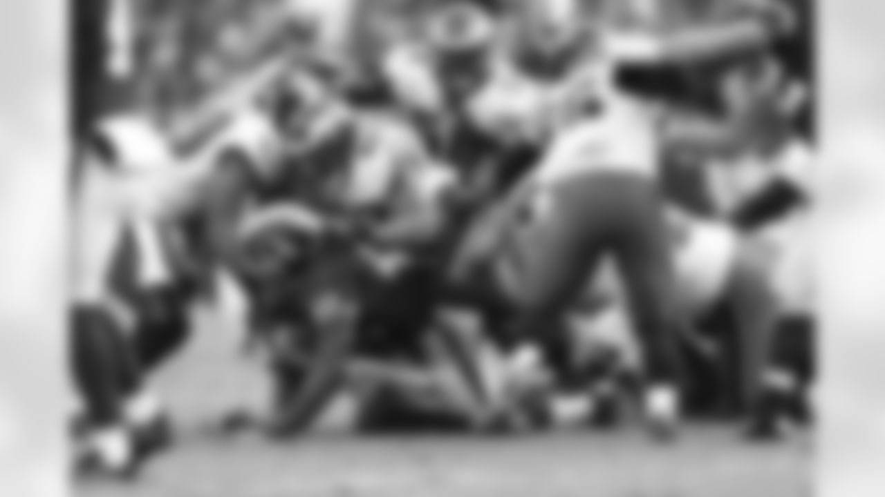 Eagles' defenders make a tackle