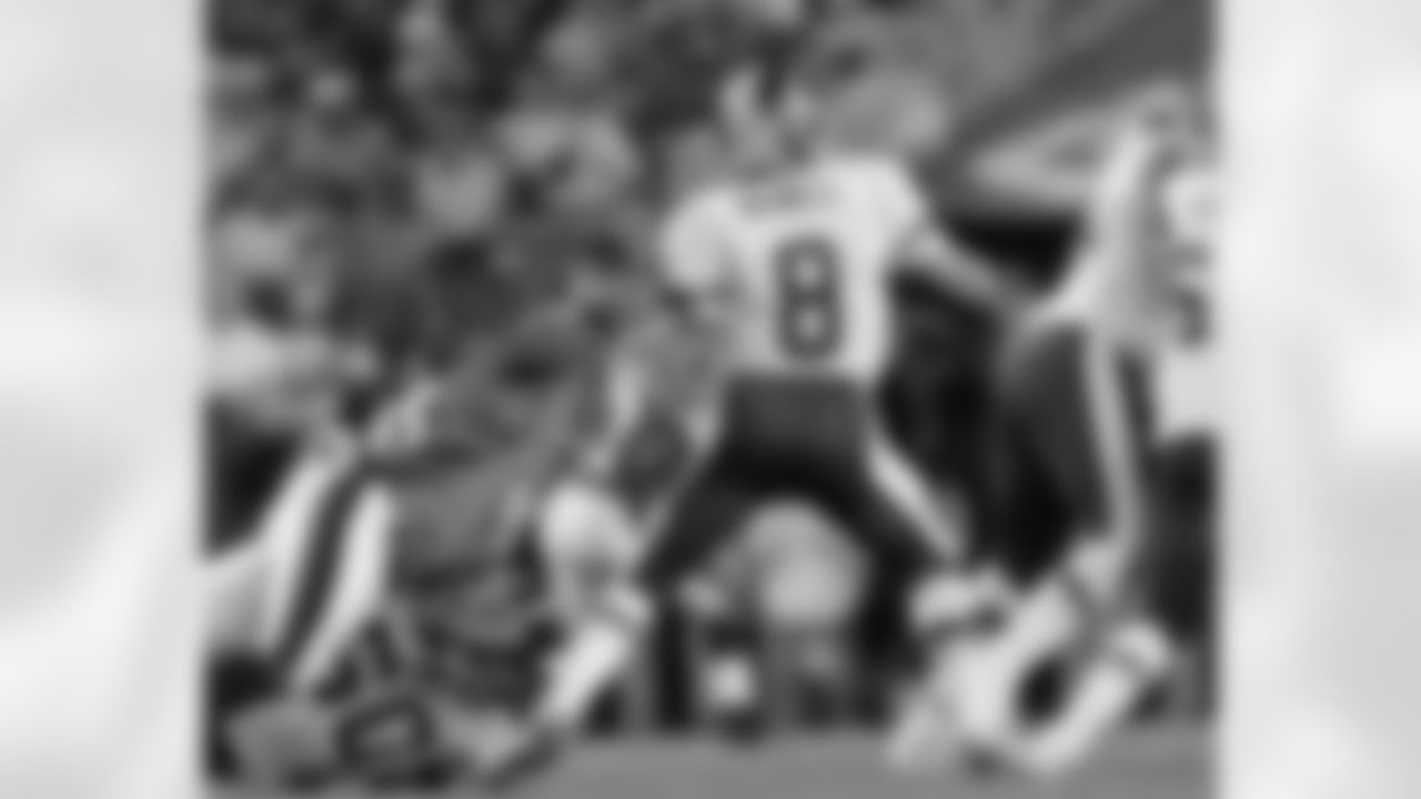 Trent Cole strips the ball from Redskins QB Brunell