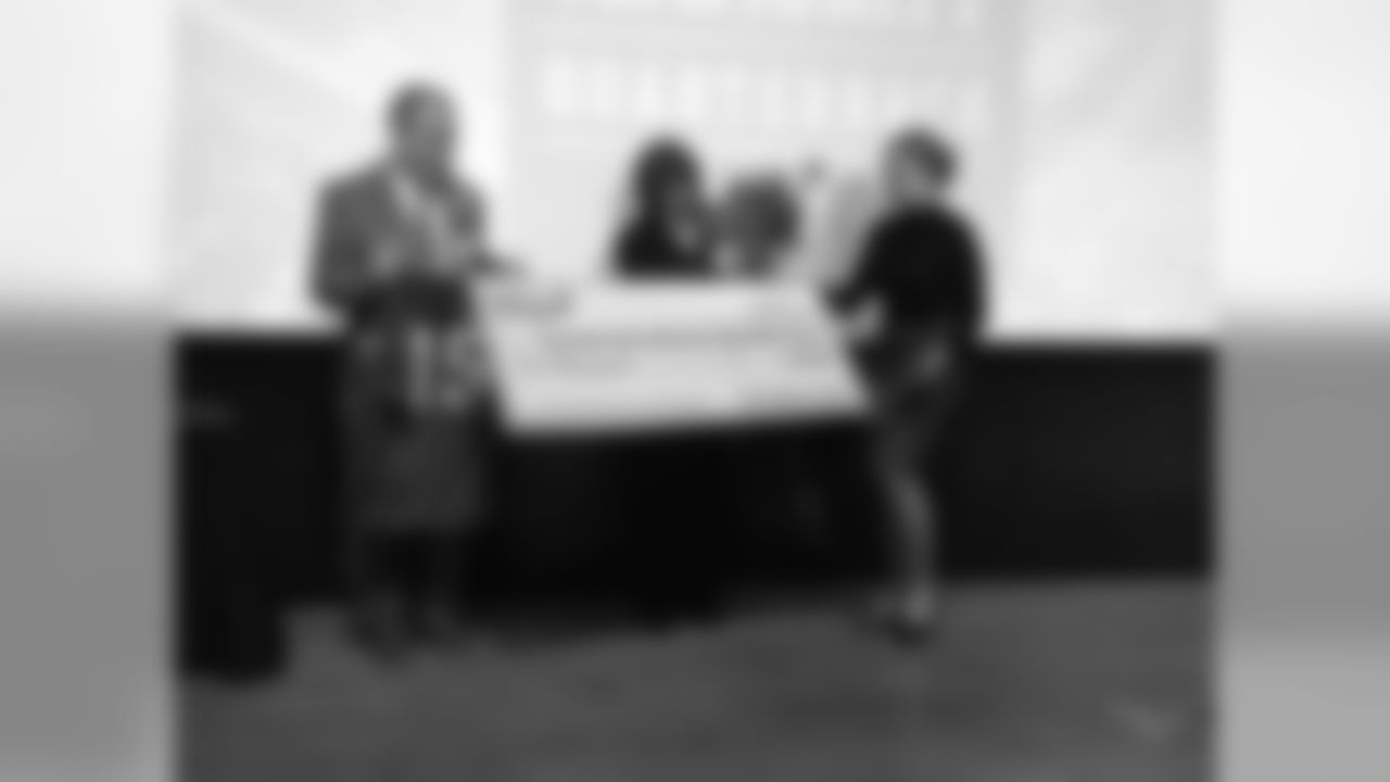 Joseph and Roseann Kirlin are presented with their check