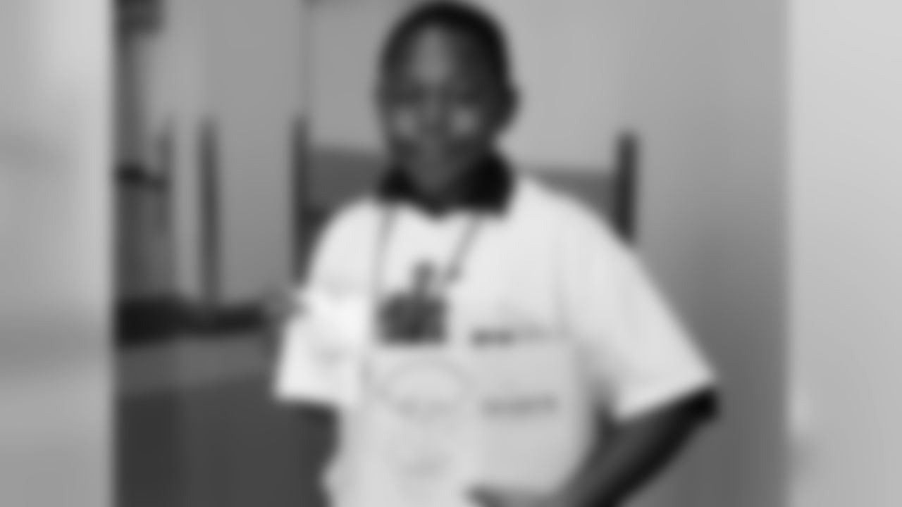 This young fan holds up his book, which he had autographed by Mychal Kendricks