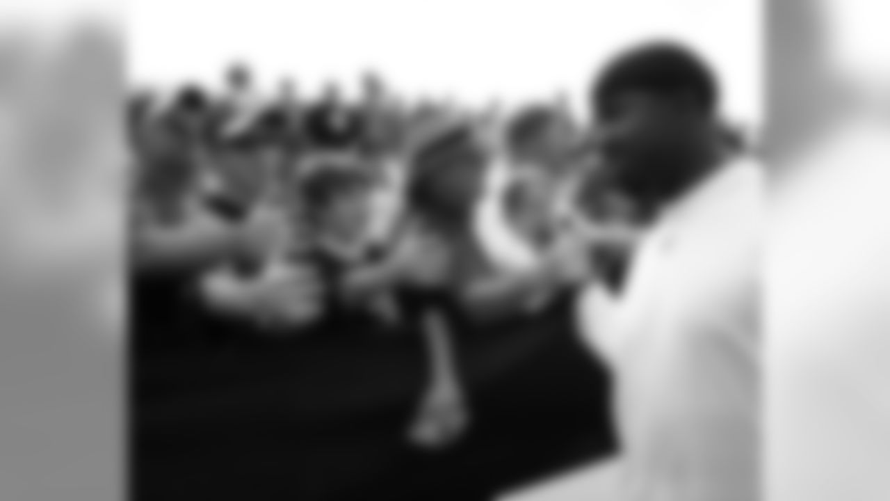 RB Brian Westbrook gets handshakes and well wishes from fans after one of the final practices of training camp