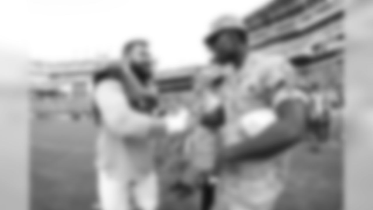 C Jason Kelce shakes greets military members.