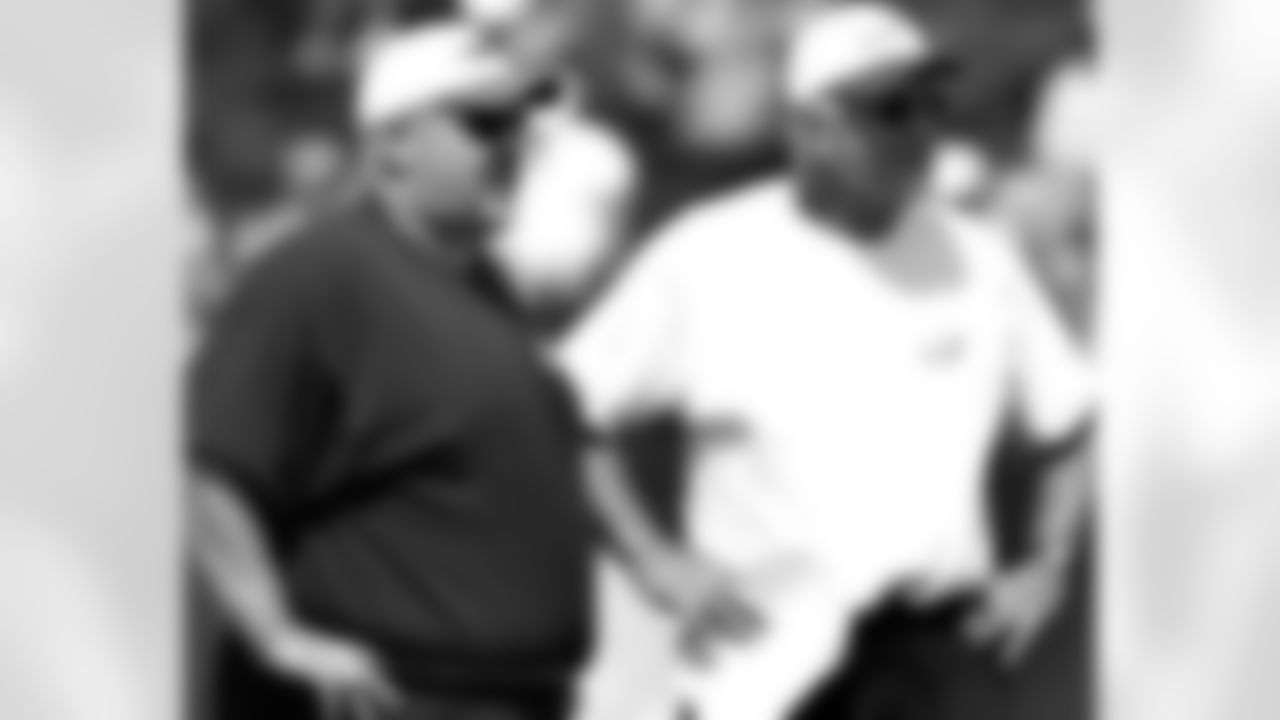 Head coach Andy Reid and defensive coordinator Jim Johnson look on