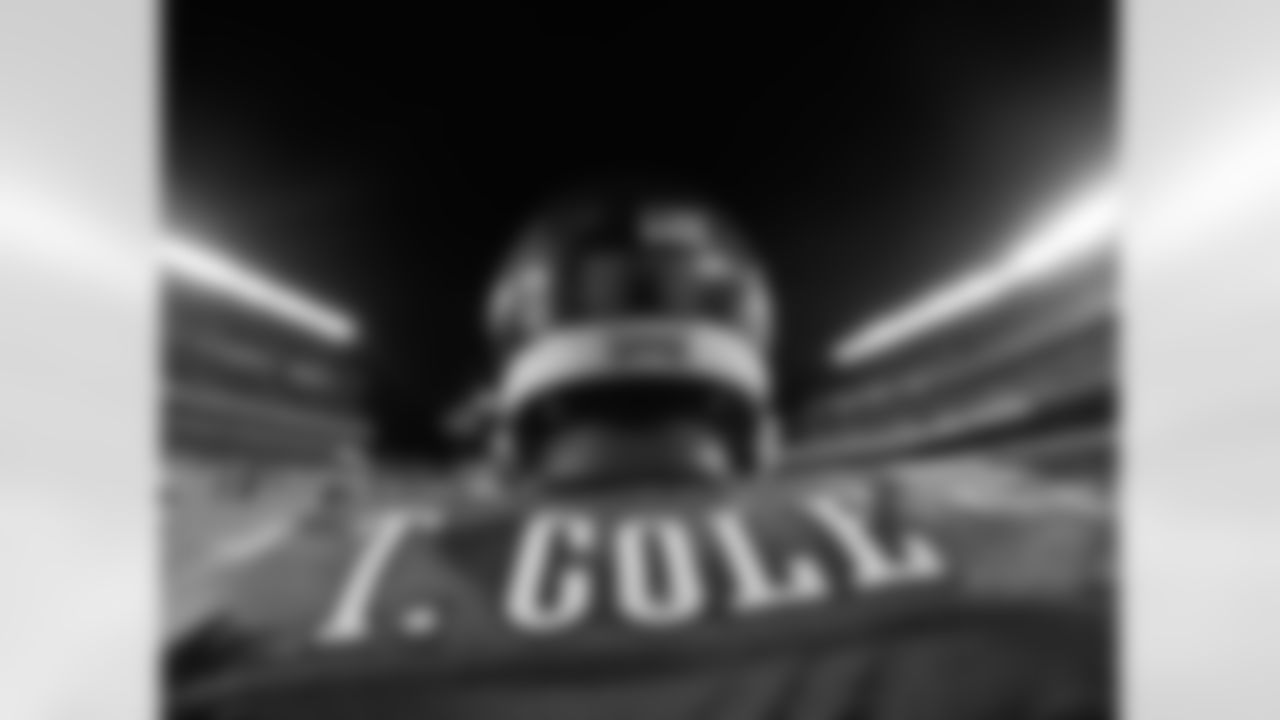 Eagles' LB Trent Cole walks onto the field.
