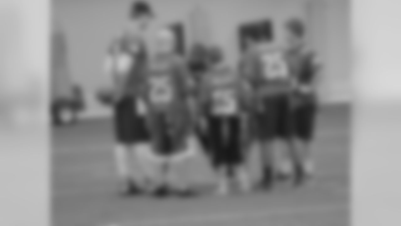 Everyone listens closely as McCoy draws up the perfect play