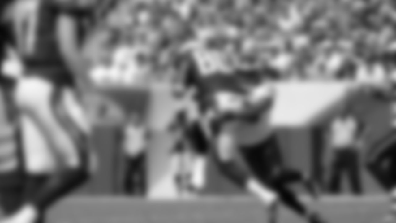 Eagles' safety Nate Allen (29) tackles Chargers' wide receiver Malcolm Floyd (80) in the first half of Sunday's game.