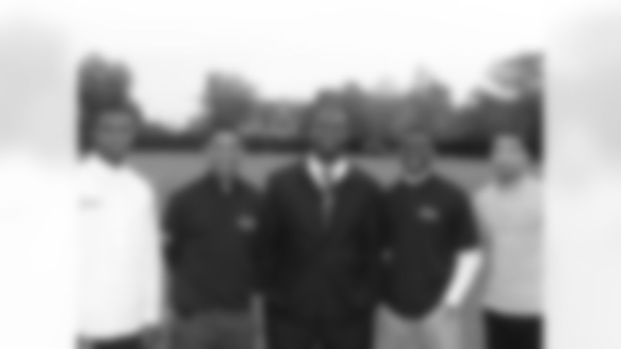 Former Eagles FB Thomas Tapeh, now the head coach at Woodrow Wilson in Camden, N.J., celebrates his school's Top Achievers