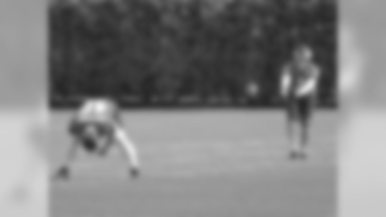 LS Jon Dorenbos snapping the ball to P Donnie Jones