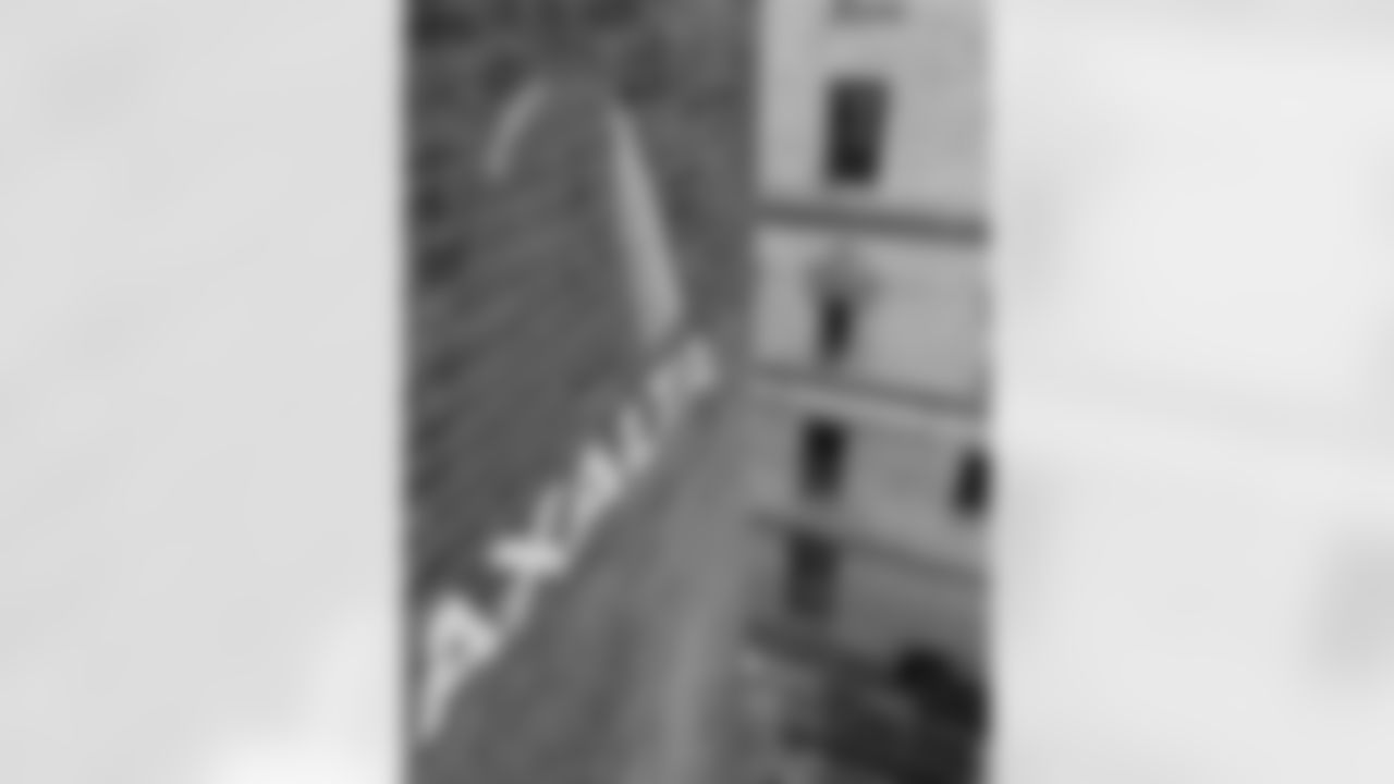 A close-up look at the Axalta logo in the mural
