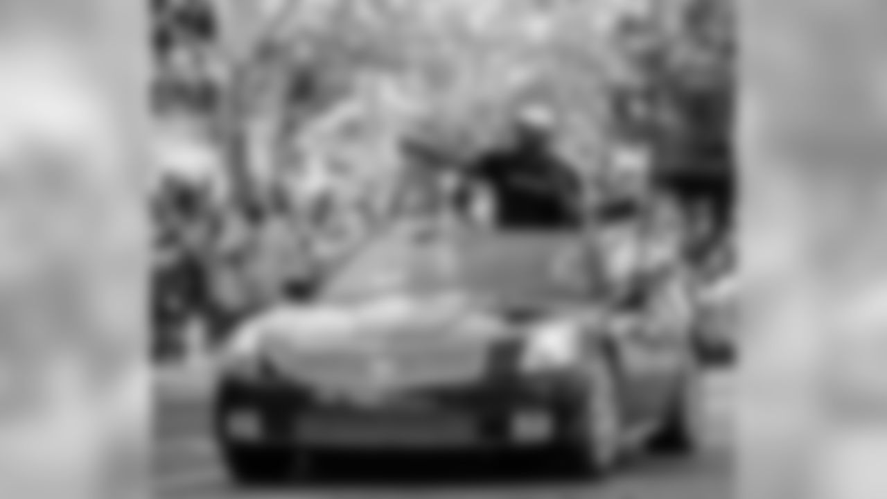 Brian Dawkins rides in his car along the parade route