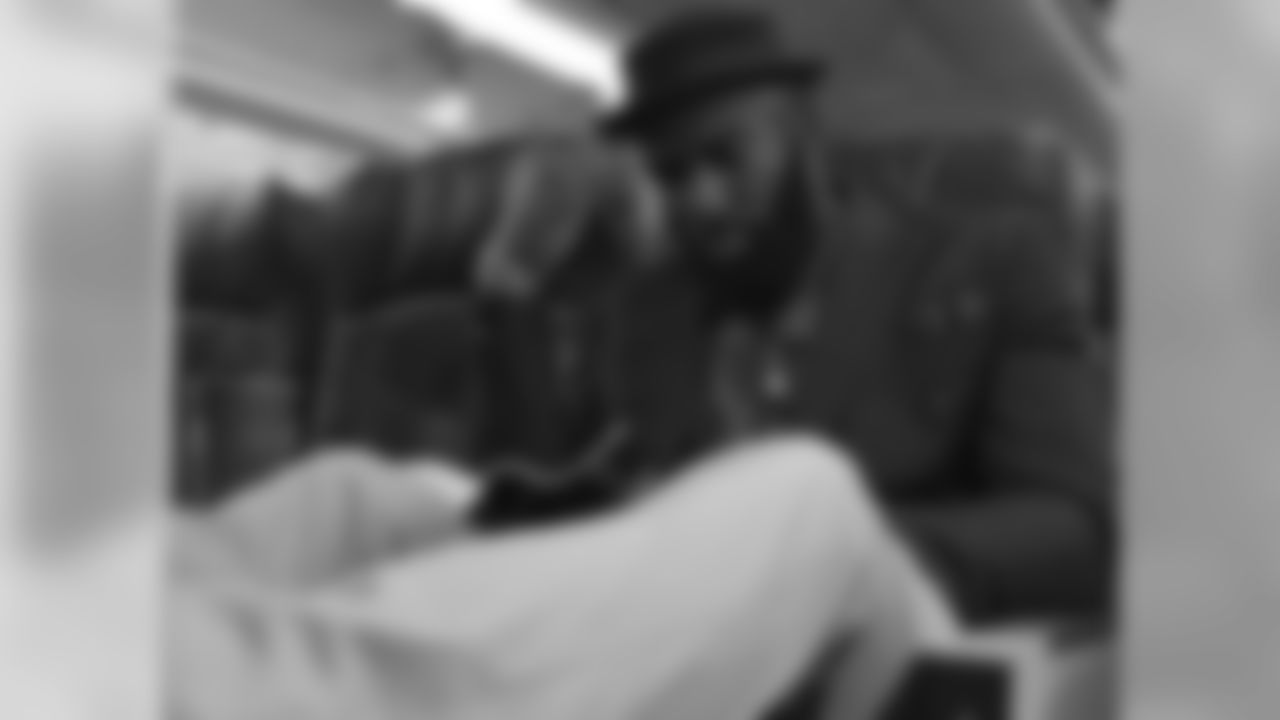 S Malcolm Jenkins reads on the plane.