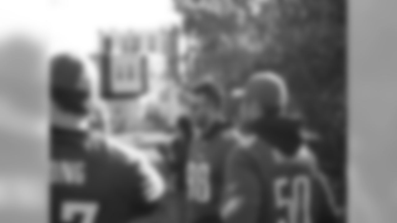 Connor Barwin, Casey Matthews and Travis Long surveying the land