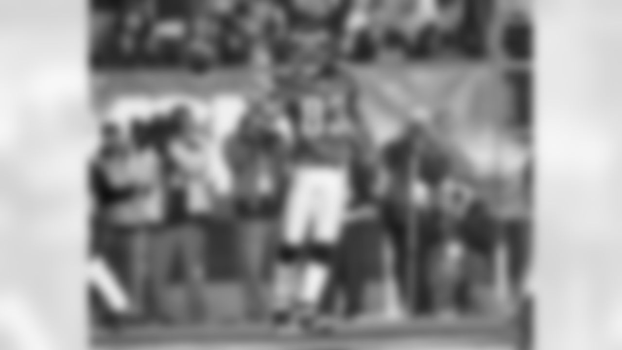 WR Greg Lewis flips the ball to the official after TD reception