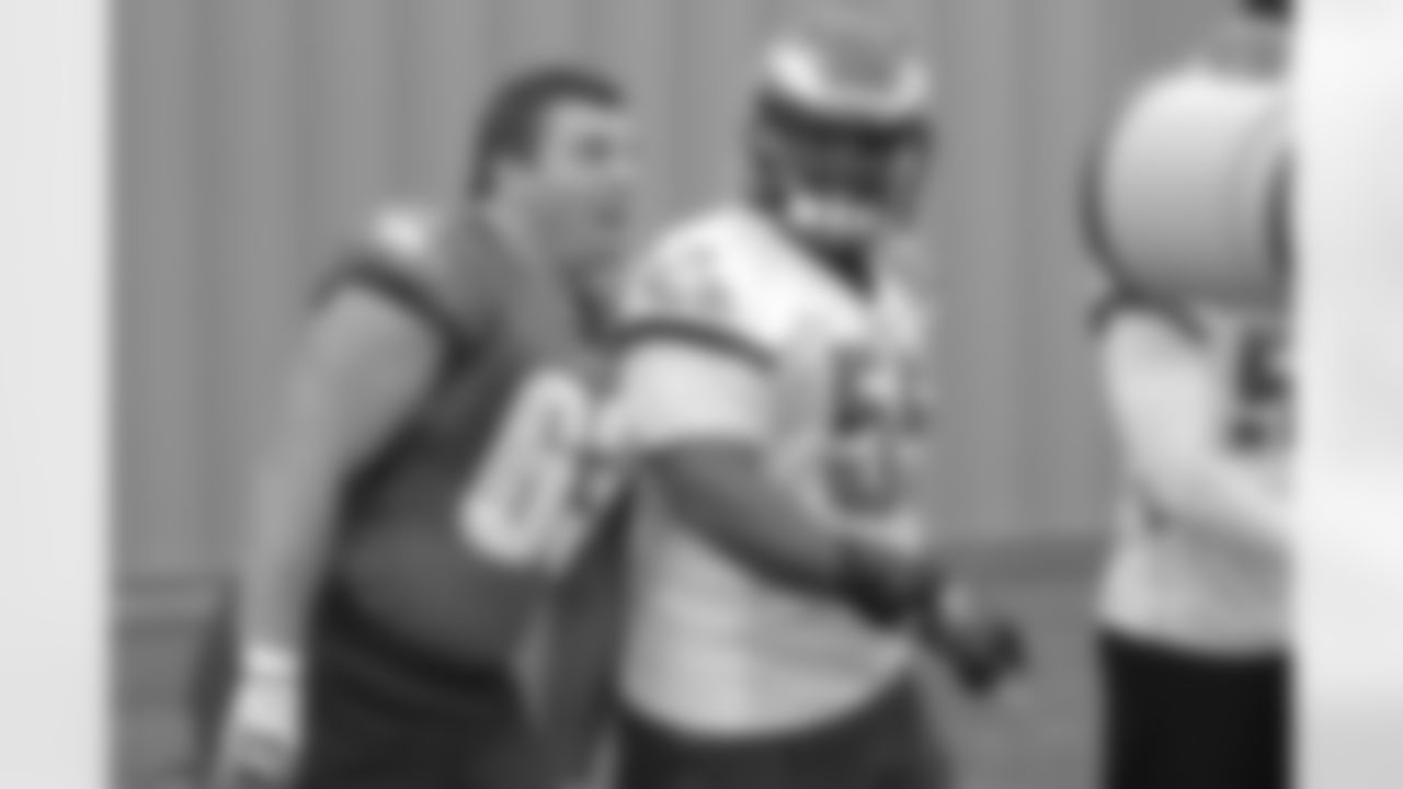 C David Molk and LB Brandon Graham share a laugh on the way out to practice