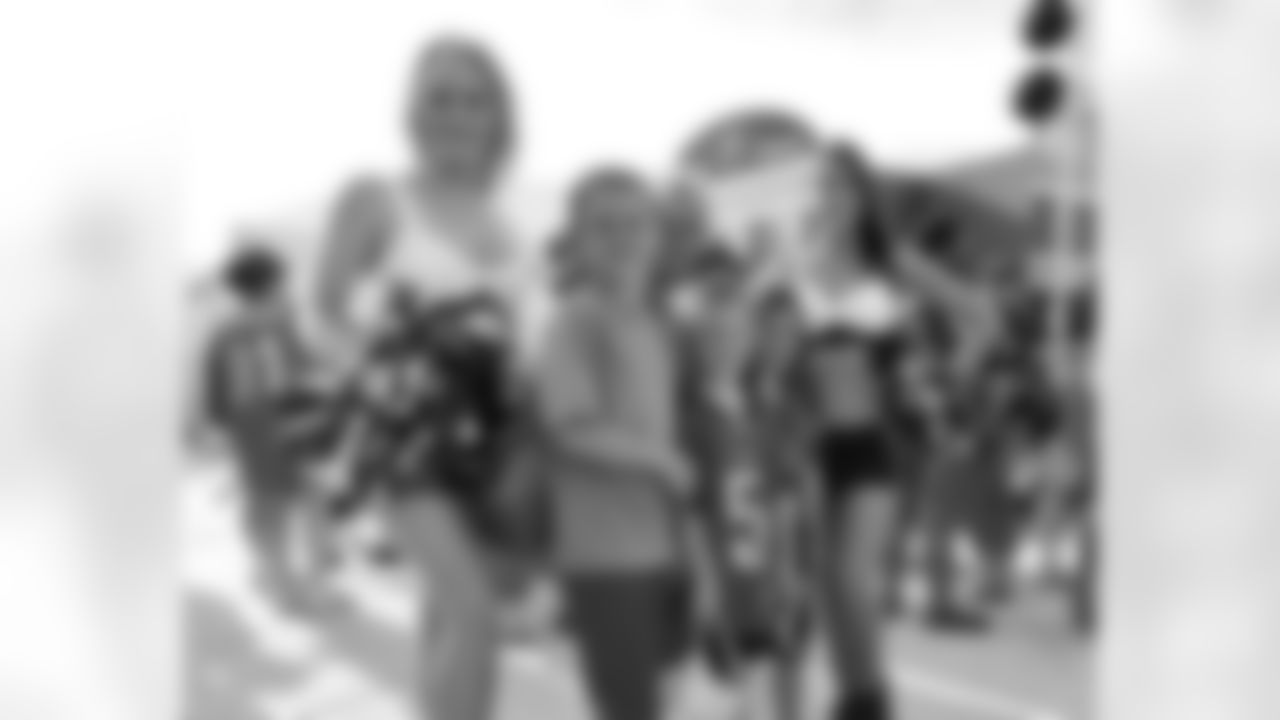 Eagles Cheerleaders Lindsey and Eva pose for a picture with some young Eagles fans