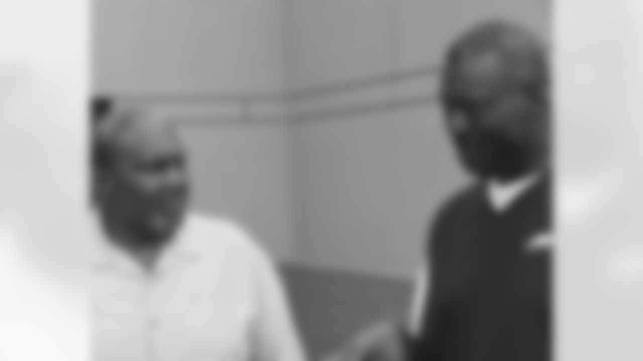 Hall of Fame OT Bob Brown talks with director of player programs, Harold Carmichael