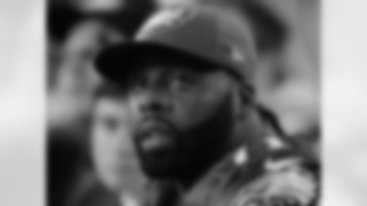 Eagles' tackle Jason Peters watches the game from the sidelines.