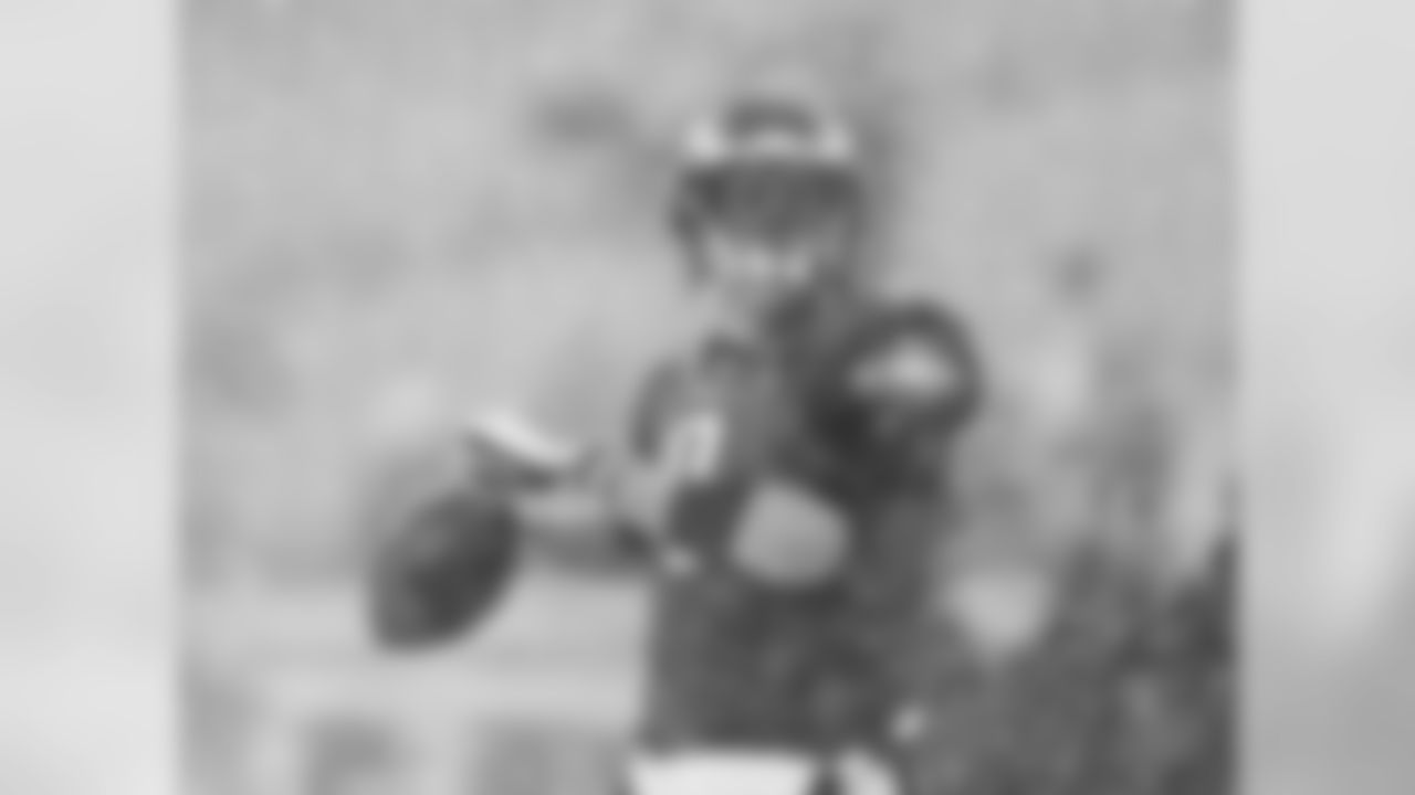 Eagles' QB Nick Foles throws a pass in the cold weather.