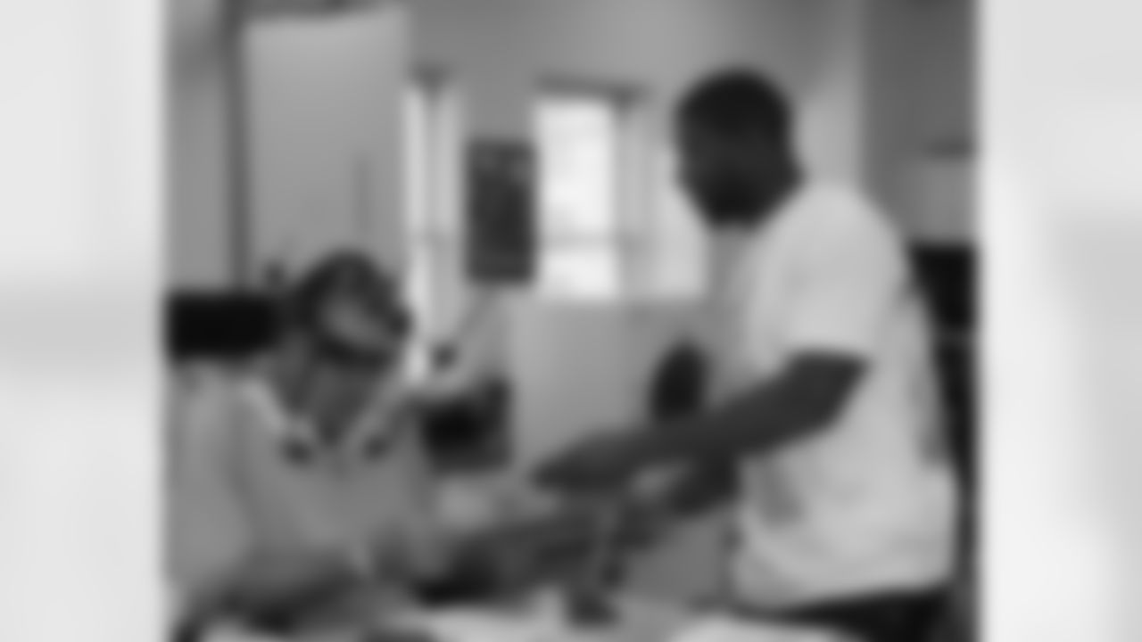 Akeem Jordan gives this patient an autographed copy of Eagles Insider