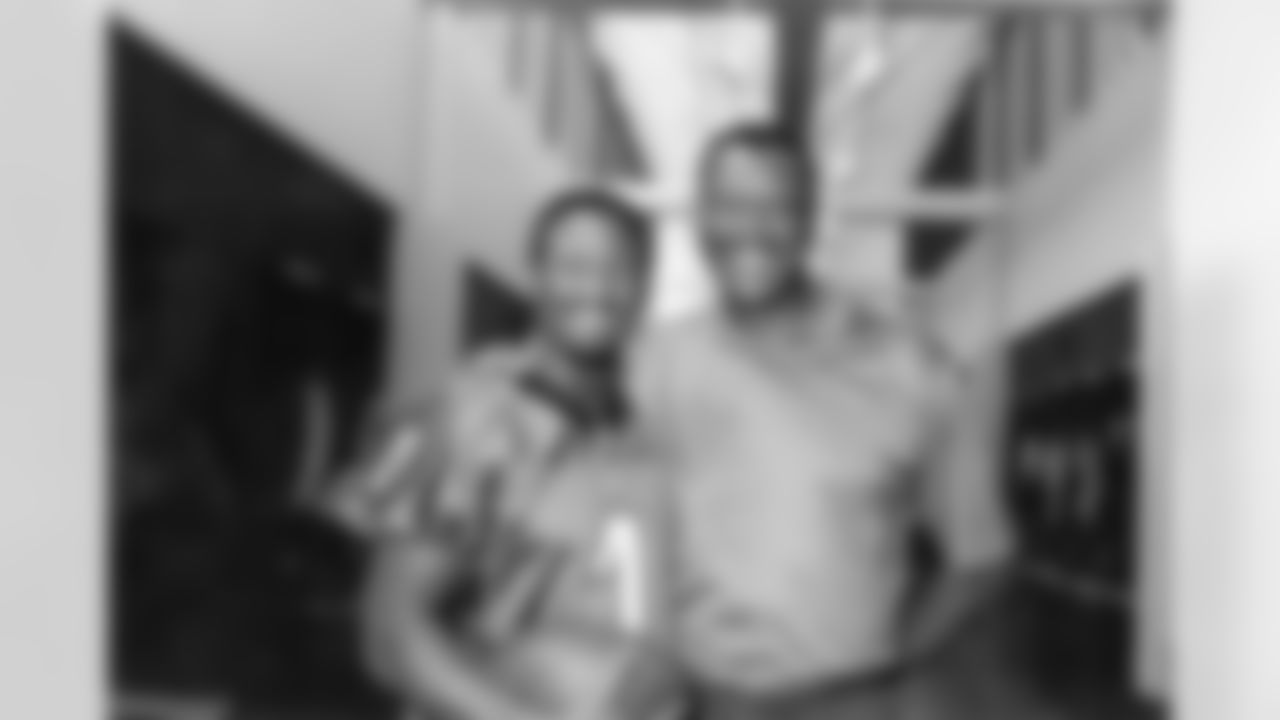 2001: UCLA WR Freddie Mitchell, the 25th pick overall, poses with former WR great Harold Carmichael