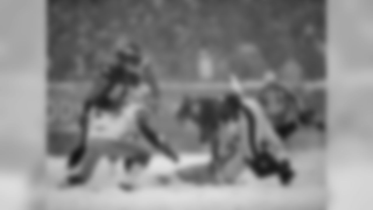 Eagles' RB Chris Polk gets tackled by Lions' safety Glover Quin.