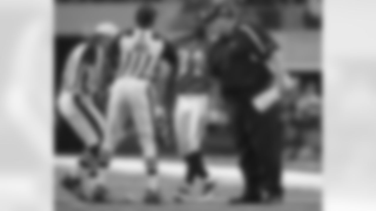 Head coach Andy Reid talks with the officials