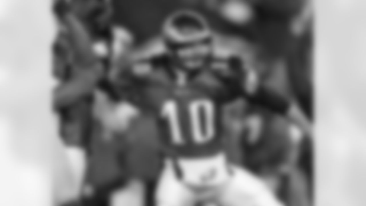 QB Koy Detmer pumps his fist after the game-winning kick by K David Akers