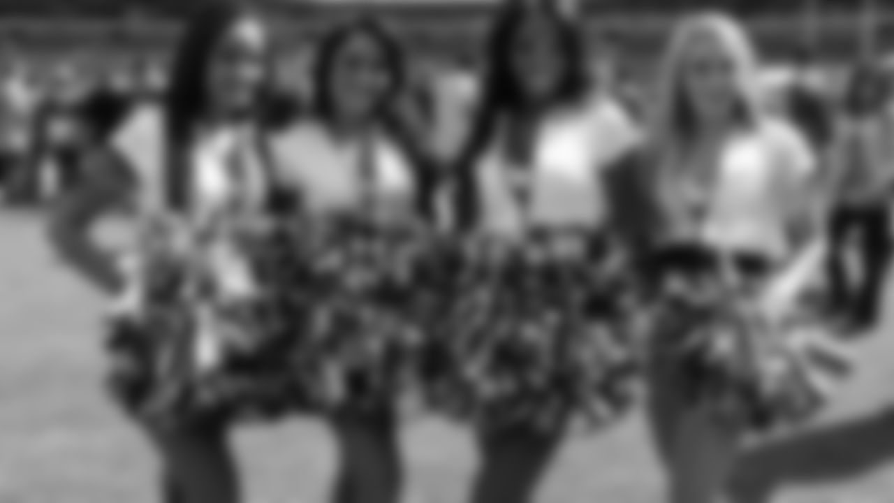 Eagles cheerleaders pose on the sidelines before the first home game of the Eagles' season.