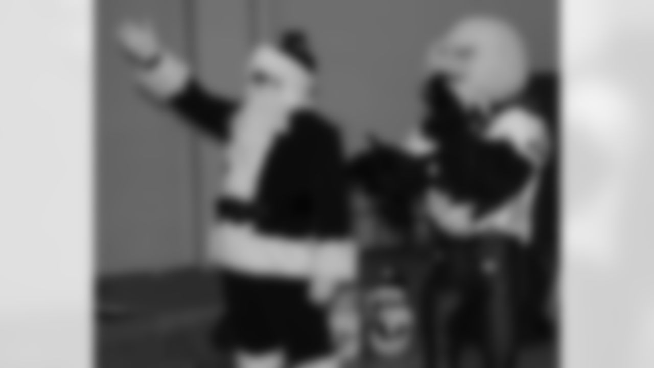 Santa Claus and SWOOP welcomed Omar Gaither and Todd Herremans