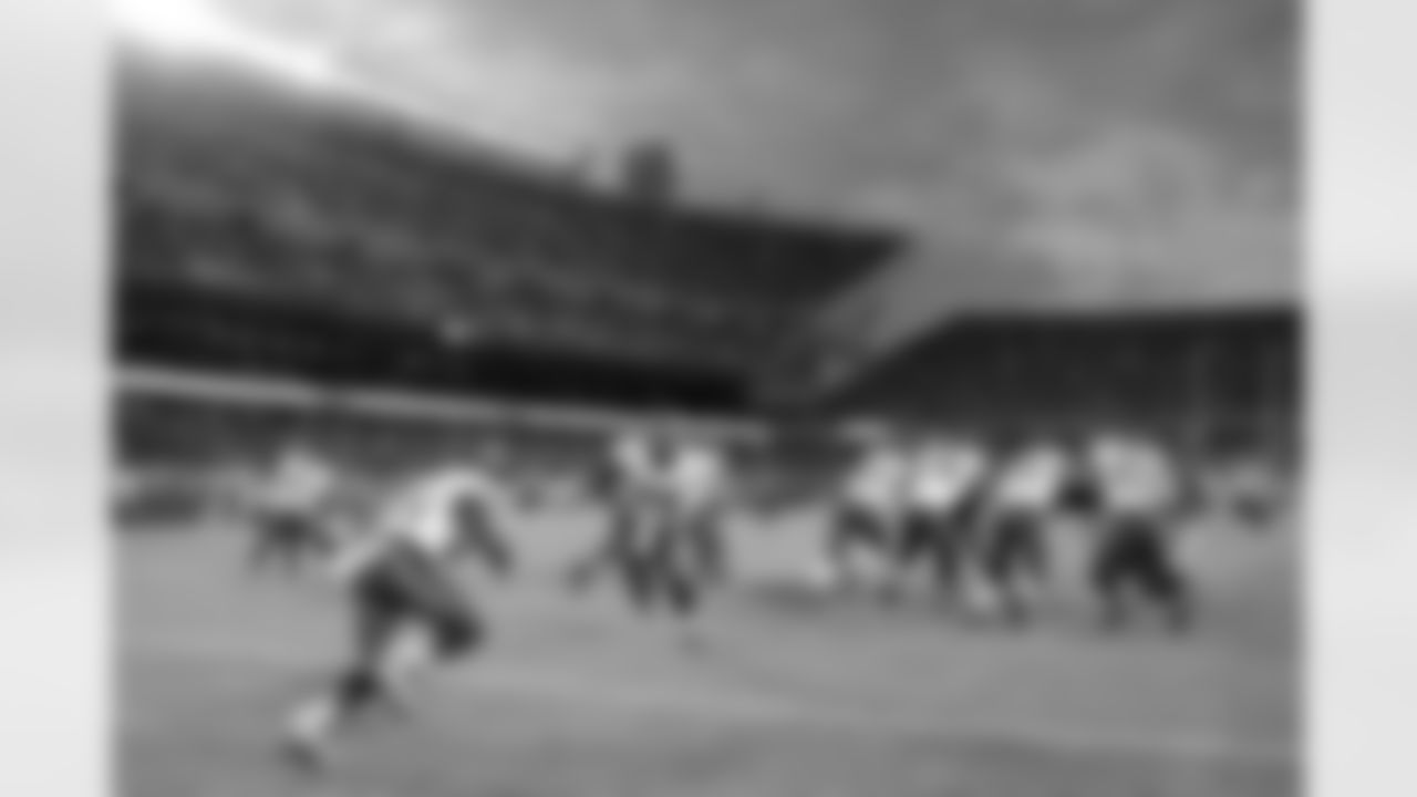 QB Carson Wentz hands off to RB Kenjon Barner
