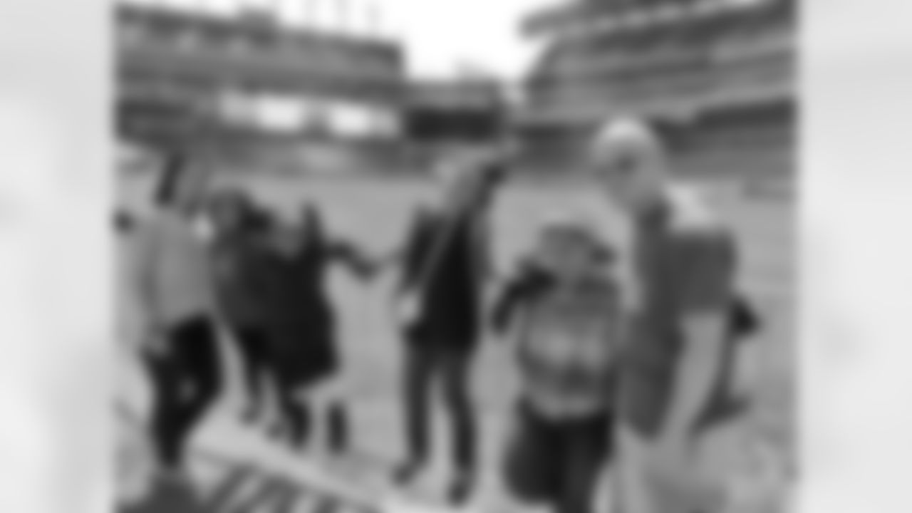 Fans enjoying their time down on the field during their tour