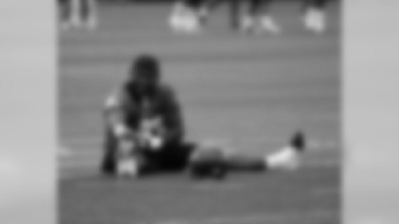 FB Leonard Weaver gets in some stretching