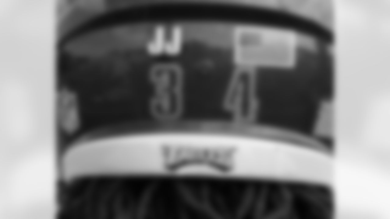 The memory of Coach Jim Johnson lives on with a JJ sticker on the back of the players' helmets