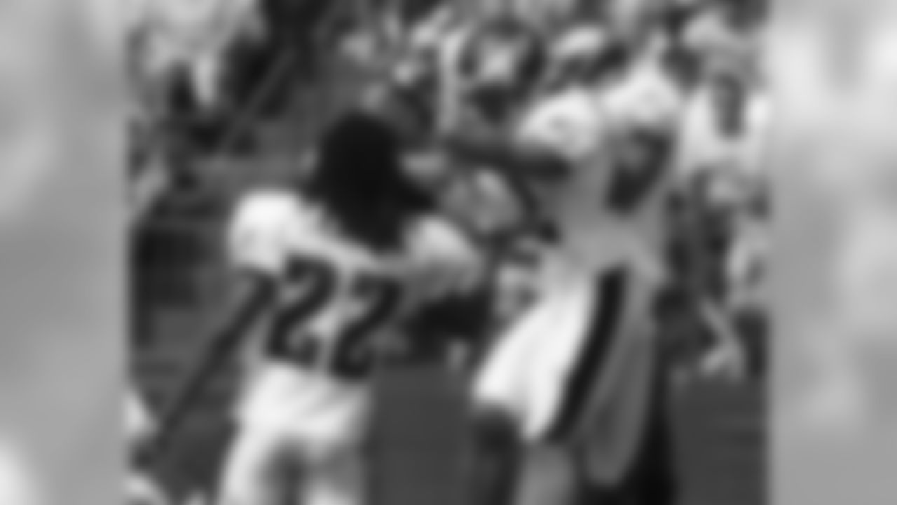 The defensive backs celebrate after an interception by S Quintin Demps