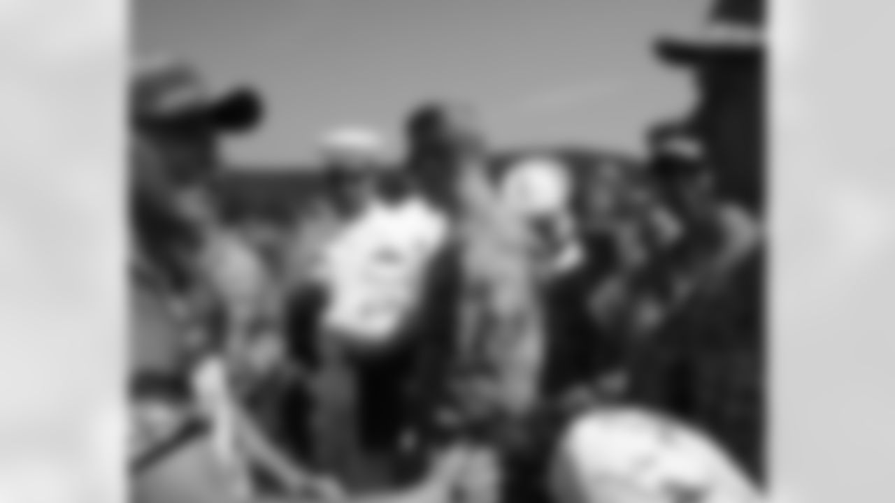 A handshake between K David Akers and U.S. serviceman