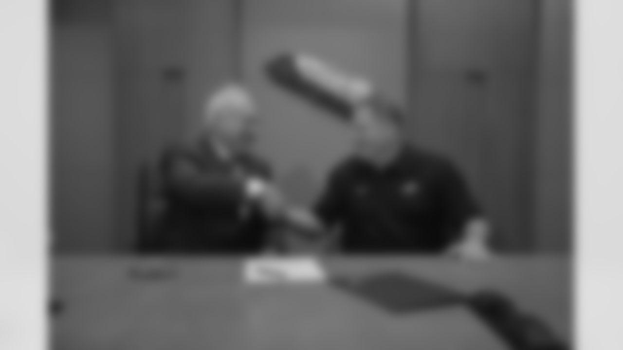 Chairman/CEO Jeffrey Lurie and head coach Chip Kelly shake hands after signing the official contract