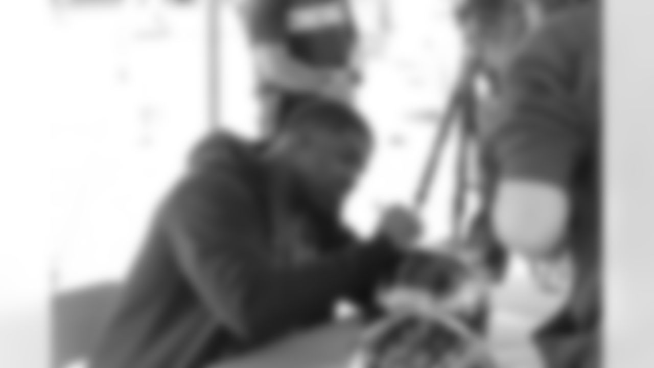 Vinny Curry signs a helmet