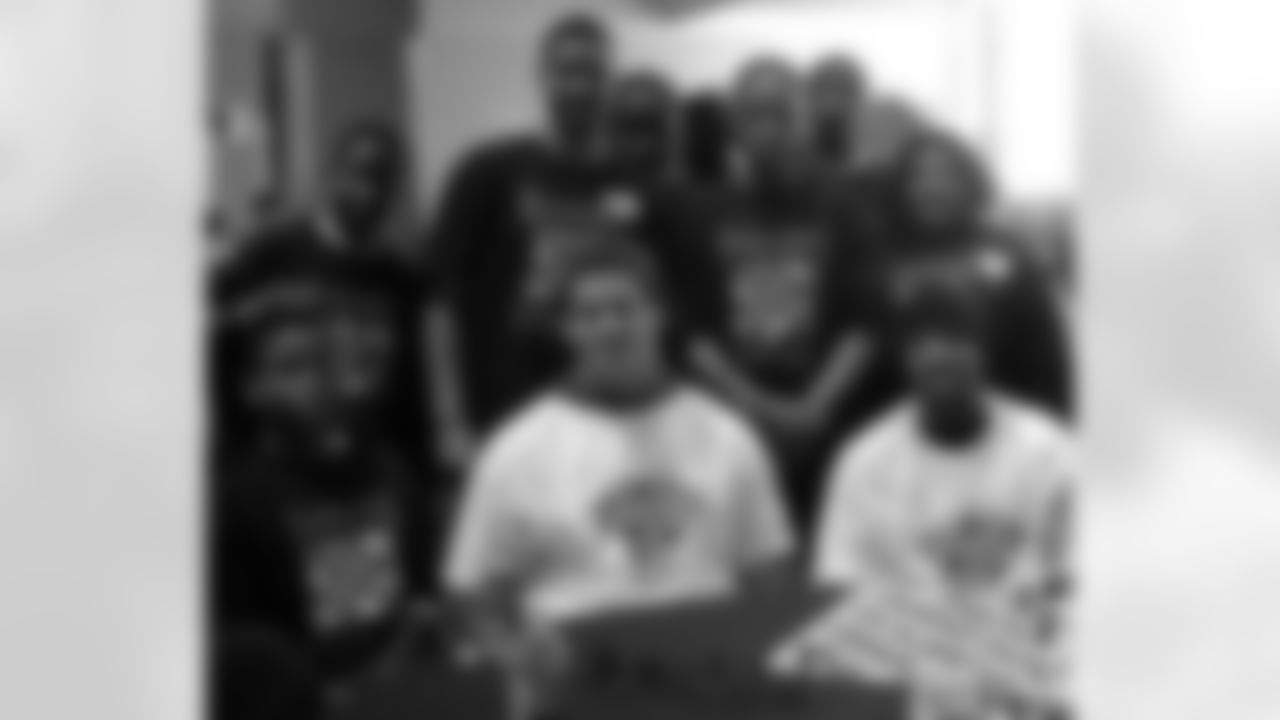 The Chess Club from Strawberry Mansion HS in North Philadelphia pose for a photo with Eagles LB Jason Short and WR Greg Lewis