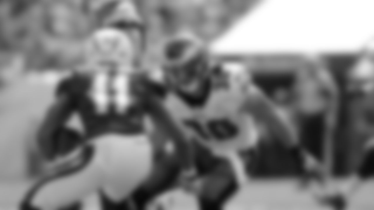 Eagles' safety Colt Anderson tries to tackle Chargers' wide receiver Eddie Royal.